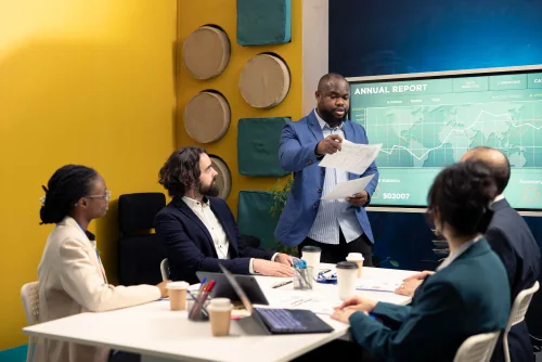 A consulting team reviewing a commercial performance report